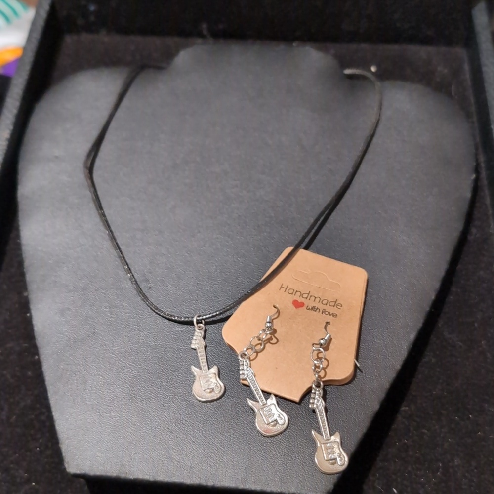 Black and silverl guitar dangle earrings and silver-tone electric guitar pendant